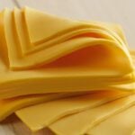 American Cheese is a Combination of Cheddar, Colby, Washed Curd, or Granular Cheeses. According to Federal Law, This Product Must be Labeled as “Processed American Cheese.”